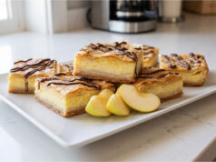 Delicate Three-Flavor Slices: Layered Pastry with Apples, Pudding, and Quark Delicate three-flavor slices with apples, pudding, and quark on a tray
