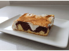 Two-Tone Cake with Pudding and Sour Cream: Moist Dessert with a Hint of Cinnamon Two-tone cake with pudding and sour cream on a tray