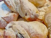 Yeast Twists with Quark and Rum Raisins: Fluffy Pastry for Your Coffee Iced yeast twists on a plate.